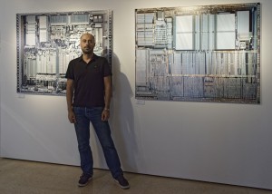 Christoph Morlinghaus in front of the very large prints of an Intel 486DX and Motorola 68030