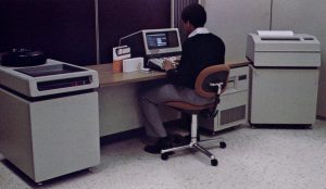 HP 3000 Series 33 - 16-bits 11MHz. They were integrated into the desk, with a 20MB hard drive on the left, and the computer on the right (with a 1.2MB 8" Floppy Drive)